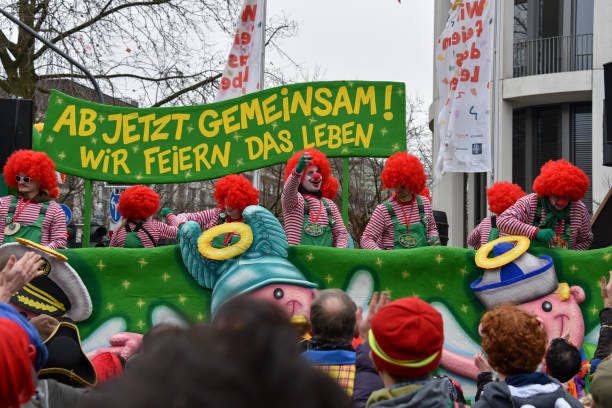 Cologne, Germany - February 11, 2024  Funny Street musicians in colorful clothes celebrating the women's carnival, Parade the rose Monday moves through the city.
