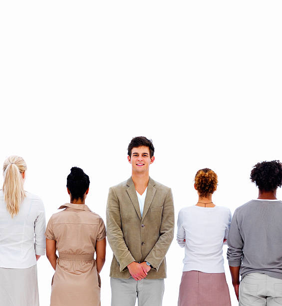 istock Businessman standing between colleagues against white background 146817870