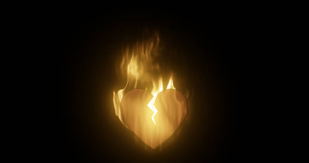 abstract fiery burning in a flame loving heart broken from love with a crack on a black background - relationship difficulties flash imagens e fotografias de stock