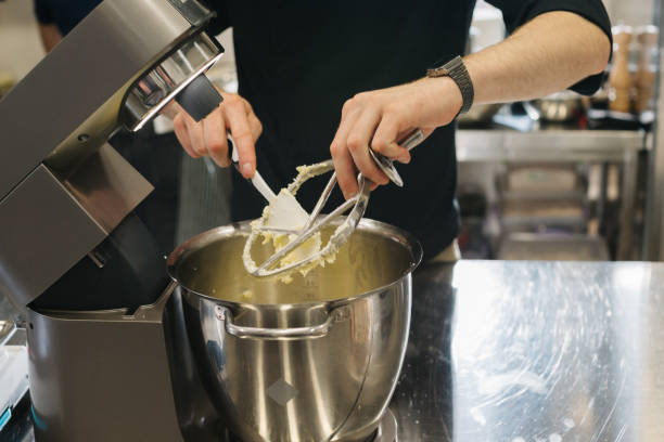 istock Making macarons. A silver kitchen table mixer kneads the dough for macarons. 1468183585