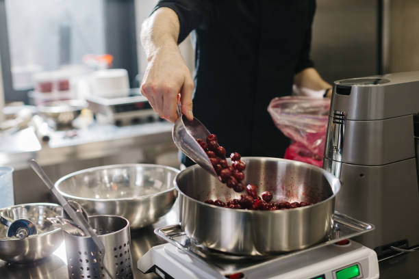 istock Close up. A chef weighs cherries for baking a fruit pie or other desserts. 1468183632