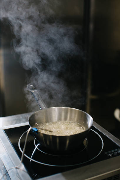 istock Cooking caramel in a saucepan on inductive cooking surfaces. 1468183863