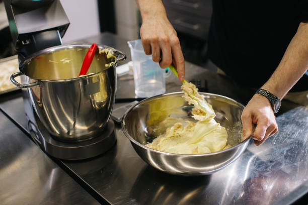 istock The chef works in the kitchen. The process of making dough for macaroons. 1468183970