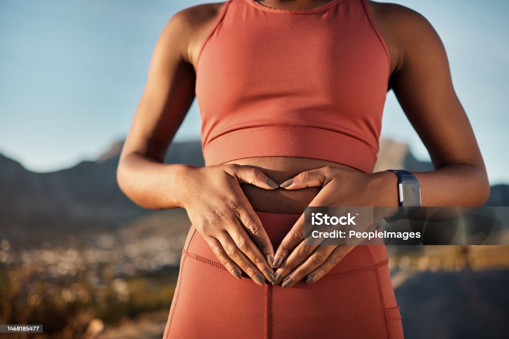 Woman, nature fitness or hands on stomach in diet wellness, body healthcare or abs muscle growth in workout training or sunrise exercise. Zoom, sports athlete or person, belly digestion or strong gut Abdomen Stock Photo