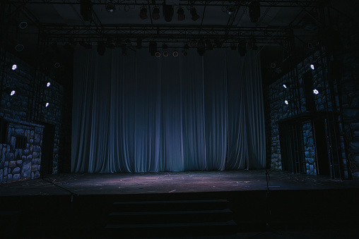 music stage theater concert with backdrop illuminated with stage light