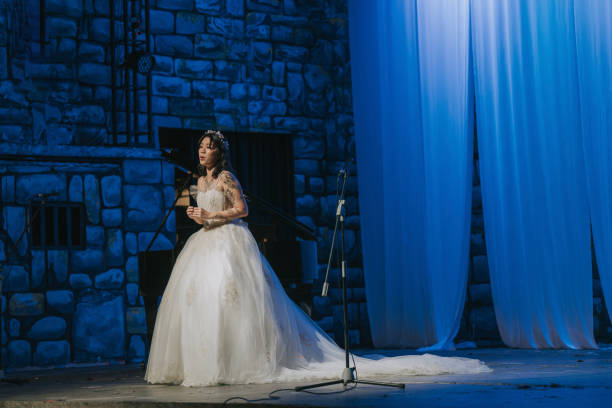 Young Chinese Female opera singer performing solo on stage