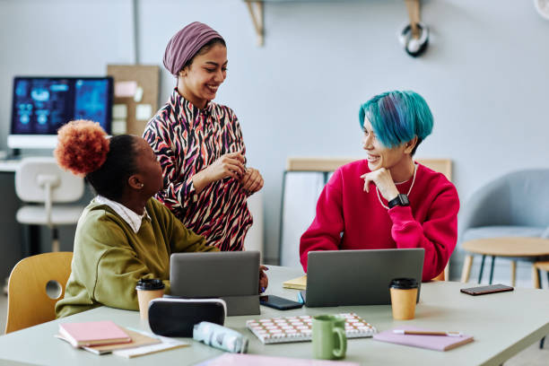 istock Diverse group of creative young people chatting during meeting in office 1468187146