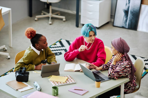 istock Diverse group of creative young people discussing project during meeting 1468187150