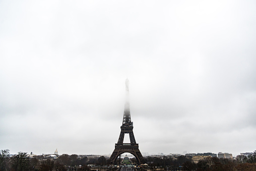 Eiffel tower under clouds