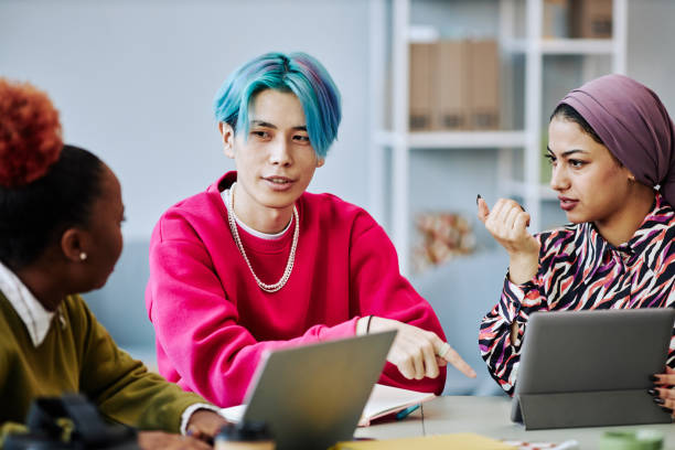 istock Young Asian man talking to creative team in meeting 1468187267