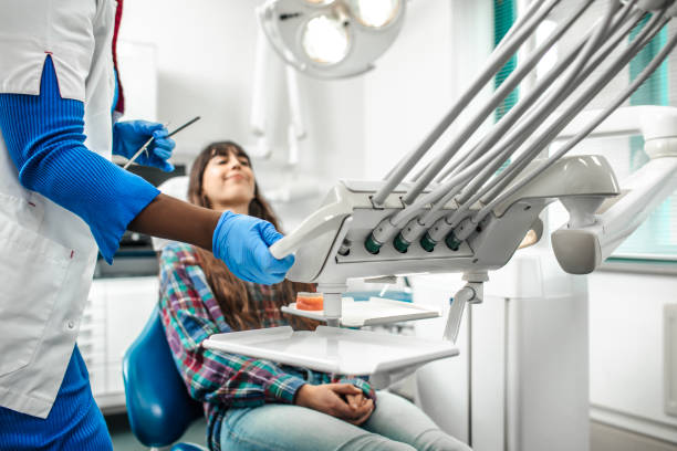 Dental check-up for a young woman at the dentist stock photo