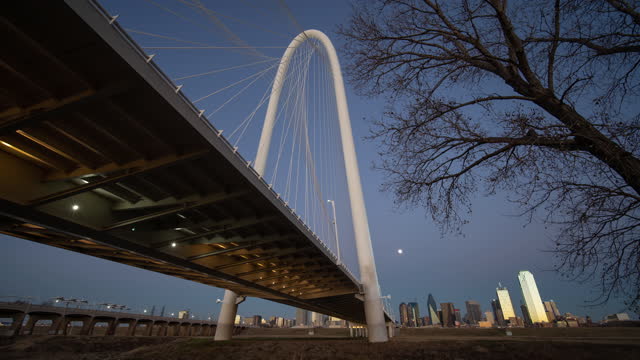 Time Lapse Cityscape City of Dallas Texas Downtown Skyline and Margaret Hunt Hill Bridge Sunset Day to Night