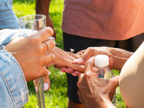 Admiring the diamond engagement ring on her hand
