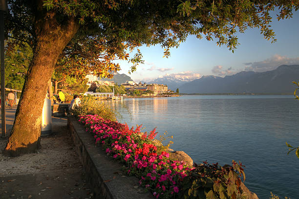 HDR landscape at golden hour time along the Quai Edouard Jaccoud in Montreux, on the shores of Lake Geneva, Switzerland.