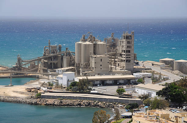 Cement Factory Cement factory at the coast cement work stock pictures, royalty-free photos & images