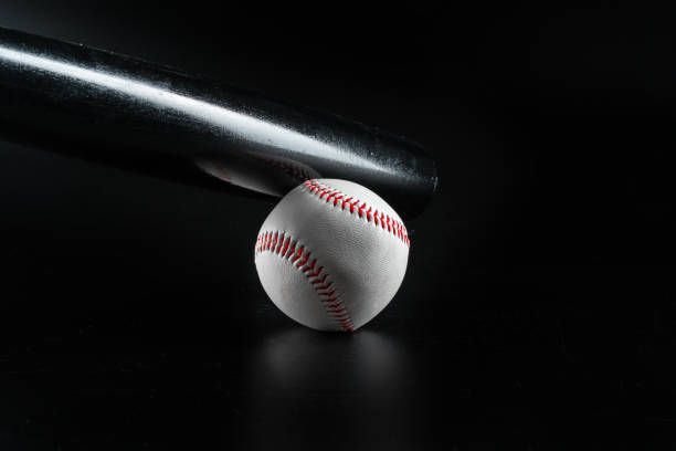 istock Baseball game equipment on dark black background 1468195730