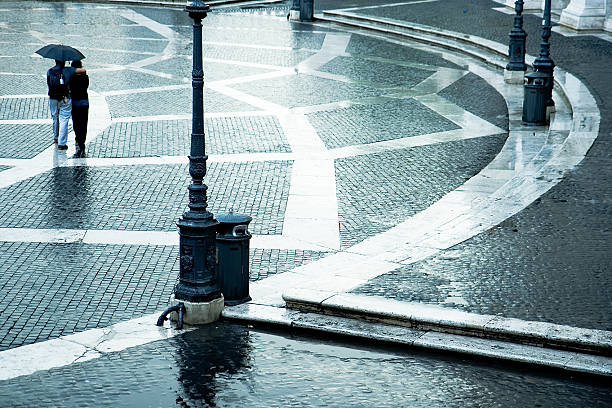 istock Rome,museum courtyard, couple under umbrella in a rain day 146819731