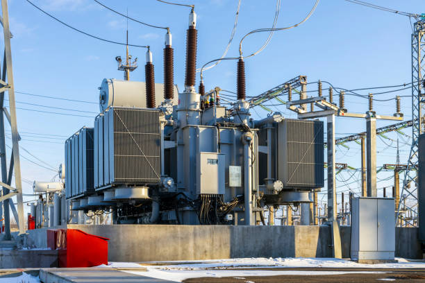 istock Power transformer in winter against the blue sky. 1468197805