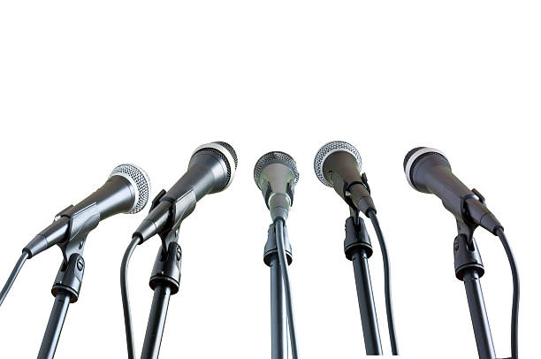 istock A row of microphones on a white background 146820001
