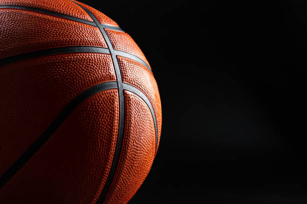 istock Basketball ball close up on dark black background 1468204133