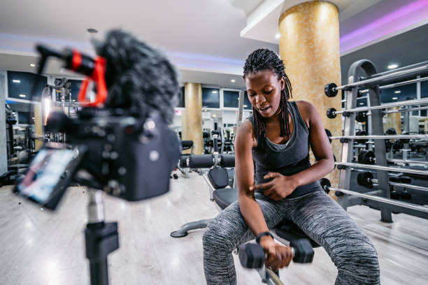 istock Fitness Vlogger Filming A Workout Routine In The Gym 1468204838