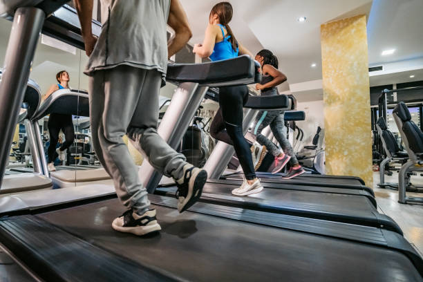 istock Three People Running On A Treadmill In The Gym 1468205319