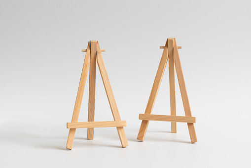 Wooden easels on white background
