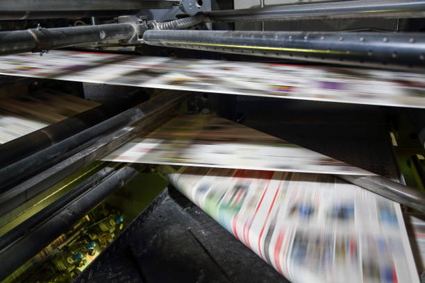 istock Newspaper folding machine in a printing plant 1468205456