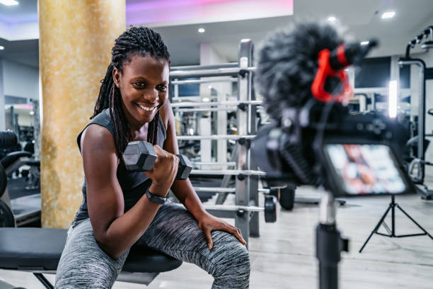 istock Fitness Vlogger Filming A Workout Routine In The Gym 1468205496