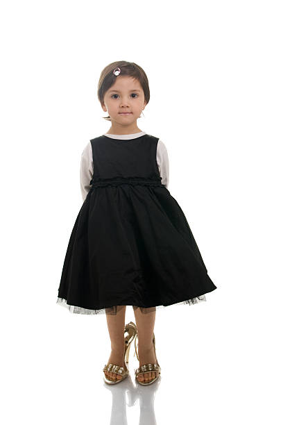istock Little girl wearing big high heels 146820805