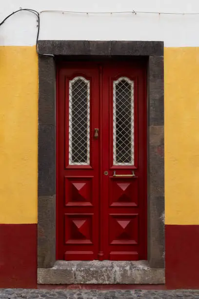 Red wooden door in Madeira island