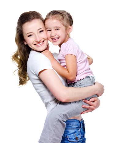 Happy beautiful young mother holding her little cheerful daughter - isolated on white