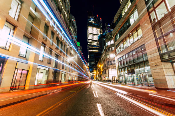 istock Long exposure with light trails and modern architecture of downtown London 1468216730