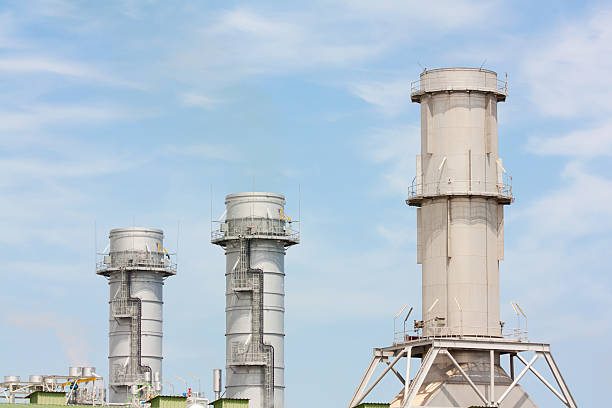 Three industrial chimneys stock photo