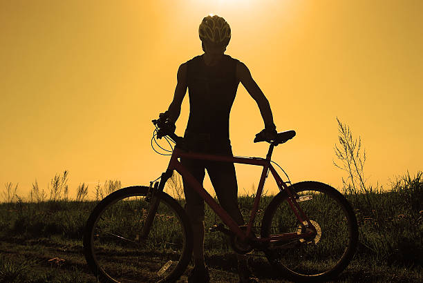 Young cyclist silhouette stock photo