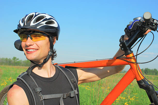 Young man with the bike stock photo