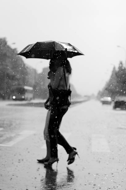 istock Two women walking under the rain 146821866
