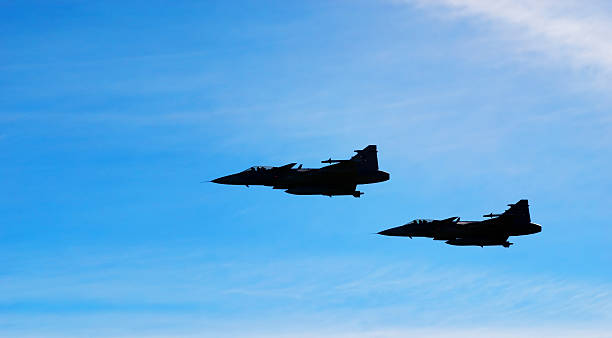 istock Two aircraft Jas 39 Gripen on blue sky 146822161