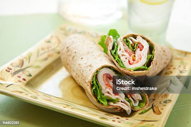 Turkey Wrap With Lettuce And Tomatoes On A Square Plate Stock Photo - Download Image Now