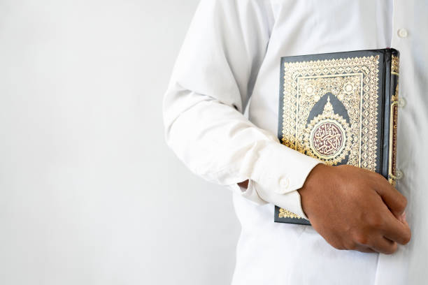 istock Man holding Quran book for copy space 1468224876