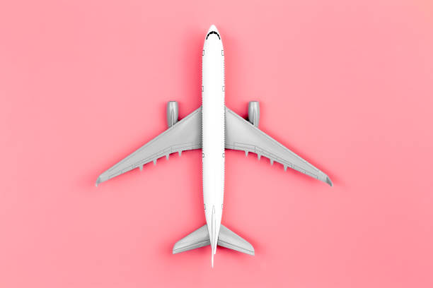 istock Airplane on a pink background, flat lay, travel concept. 1468225201