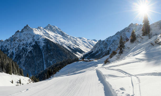 istock Winter landscape with a ski slope and snowcapped mountains 1468225279