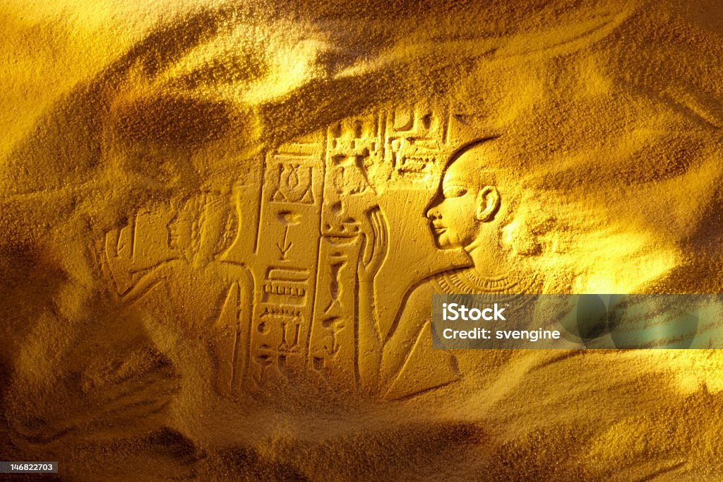 Ancient Egyptian hieroglyphs drawn in sand Ancient Egyptian hieroglyphs uncovered in the sandy desert Alphabet Stock Photo