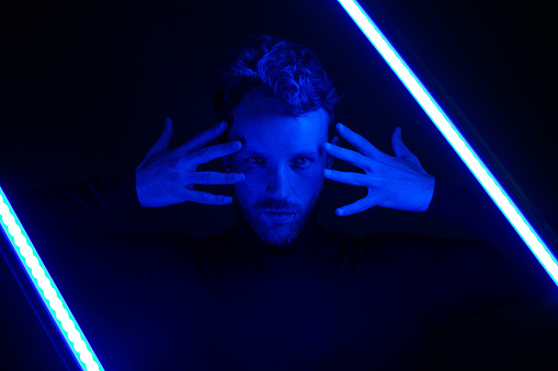 Portrait of a man in neon light, cyberpunk.