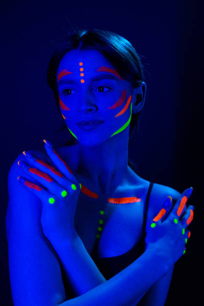 istock Girl with ultraviolet make-up in neon light. 1468228099