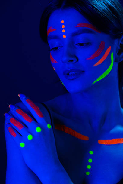 istock Girl with ultraviolet make-up in neon light. 1468228123