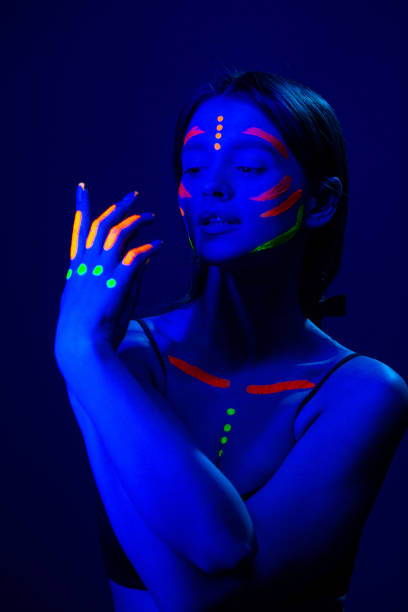 istock Girl with fluorescent make up on her face and chest 1468228153