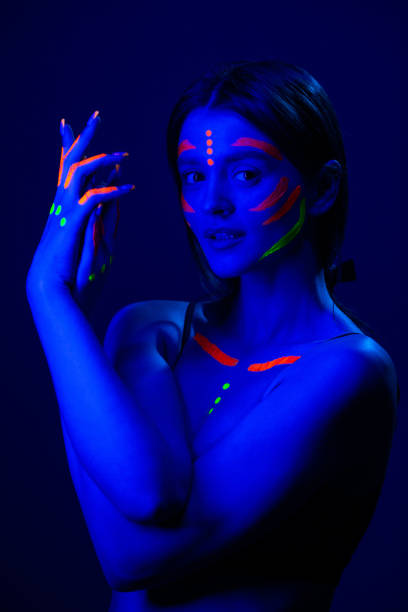 istock Girl with fluorescent make up on her face and chest 1468228172