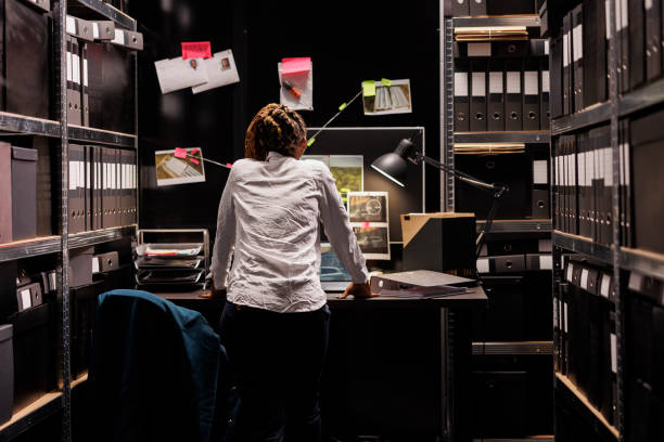 istock Woman private detective studying crime case board on wall 1468228189
