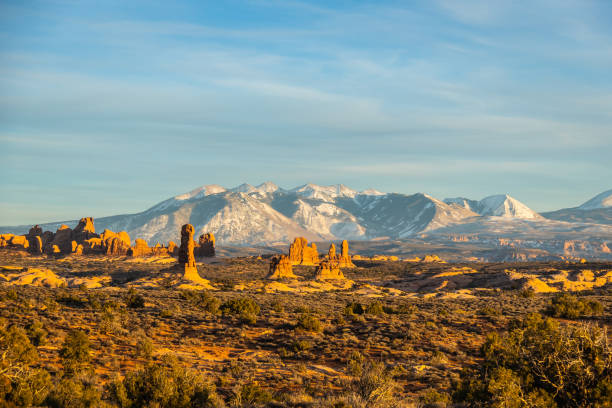 istock Rock formations with distant snow-covered mountains in the distance 1468232559